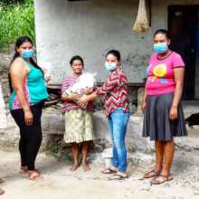 Community Leaders distribute food rations.