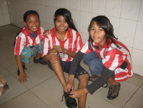 Sokha (on the right) preparing for soccer