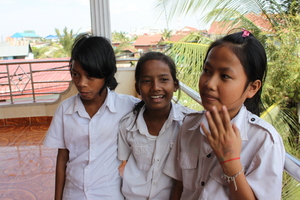 Tony, Sreyheng, and Channa talking about school