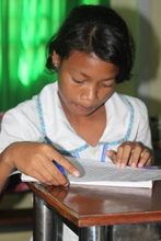 Channa taking a test in school - she earned a 100%