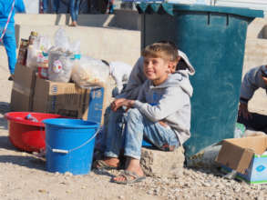 This young boy is selling cokes and water