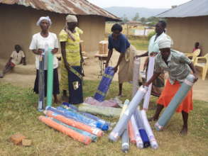 Women Recieving Materials for tailoring Project