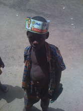Boy in Gidanturu collecting donations for Hati