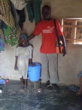 Girl in Gidanturu w/her CWS safe storage container