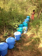 Buckets all lined up to be filled with clean water