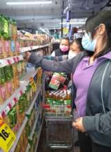 Our staff shopping for home food baskets