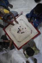 Children love playing carrom board