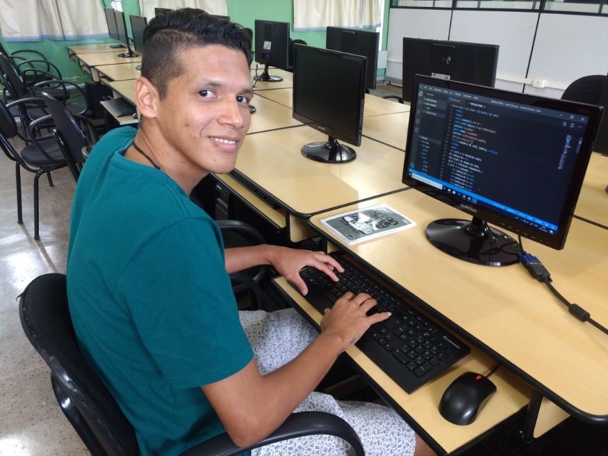 Juan learning how to code at the POETA Center