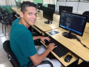 Juan learning how to code at the POETA Center