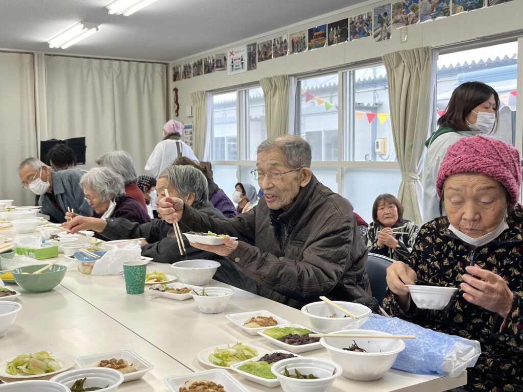Local elderly residents enjoying local delicacy