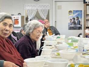 Local elderly residents enjoying local delicacy