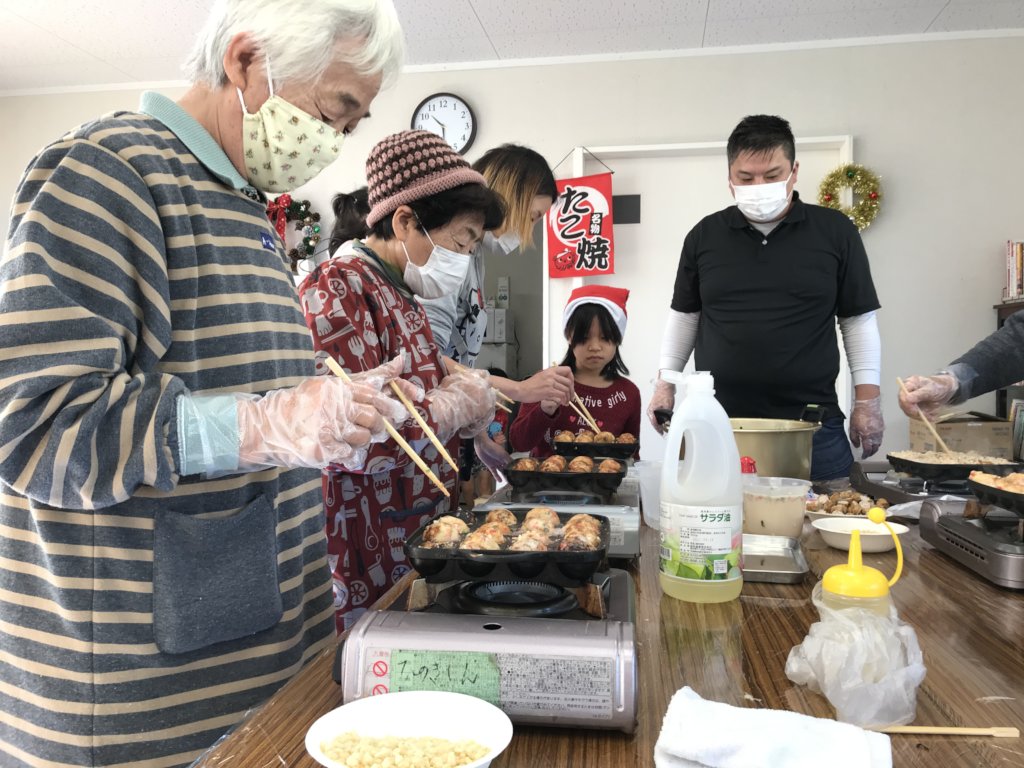 Cooking takoyaki at a Christmas event!