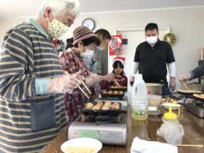 Cooking takoyaki at a Christmas event!