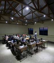 Classroom studying by solar lights in the evening