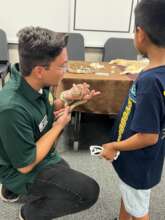 Student meets one of our animal ambassadors