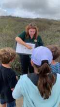 A Field Naturalist helps record observations
