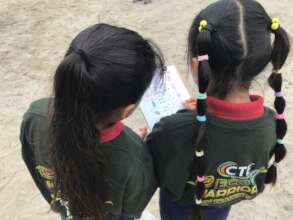 Kindergarten students collect data on butterflies.