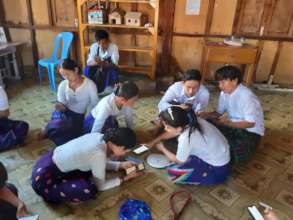 Students using MyLibrary in refugee camp in Kachin