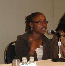 Nakea presenting at conference.