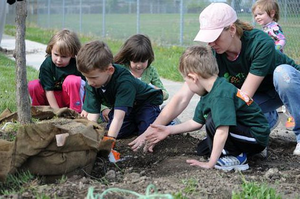 Our littlest volunteers love to plant trees!