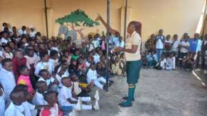 Teacher dressed as a student addressing learners