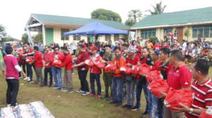 Volunteers passing relief goods