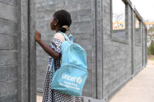 A girl is looking at her new school