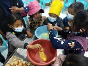 Children bake cookies at the new bakery