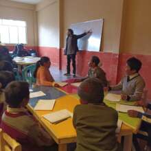 Freddie teaching English