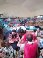 Volunteers meet at an AAI sponsored school library