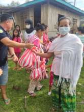 Families receive food, hygiene supplies and books