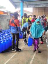 Families receive water, food, and hygiene supplies