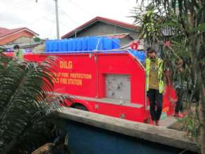 The fire department helps deliver containers