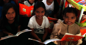 Girls educated in refugee camp read story books