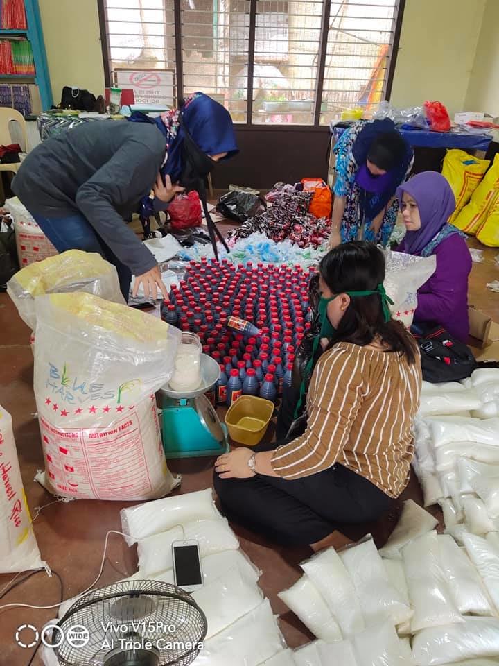 AAI volunteers assembling care packages