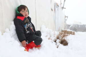 A child sitting on the snow