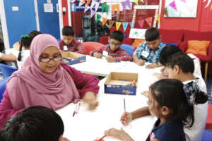 Teacher with Students in Maldives