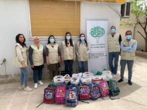 Jiyan distribution team with some relief baskets