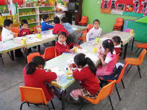 The children enjoy drawing at the Center.