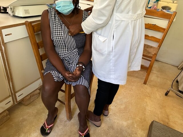 APF clinic staff care for a woman