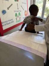 APF clinic staff take care of a child