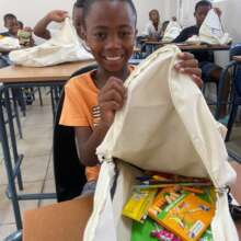 Learner with his stationery and backpack