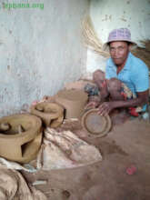 Bary making cookstove and short of pans