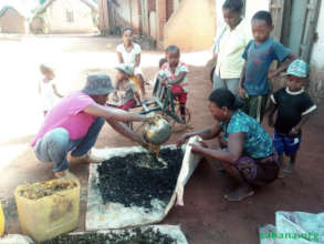 Making bio-charcoal under watchful eyes