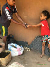 Rebecca is helping her dad in the charcoal work