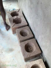 Another artisan with an improved cookstove model