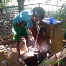 Washing hands before eating (with his cup nearby)