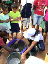 Preparing the charcoal clay mixture for pressing