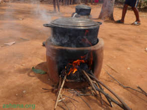 Improved cookstove outside for open air cooking