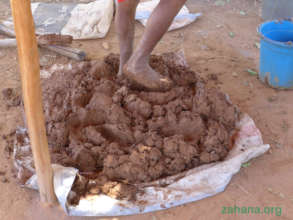 Mixing clay and other substances for the cookstove